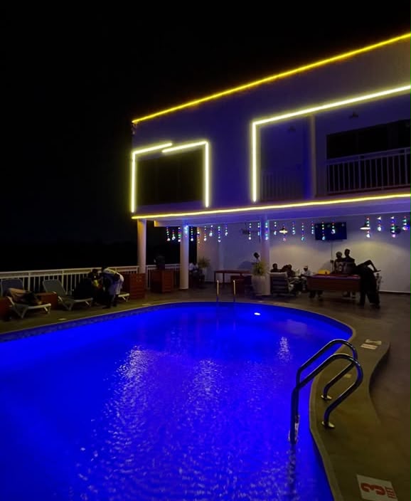 Resort pool at night with warm ambient lighting at Ad Virgin Island Resort