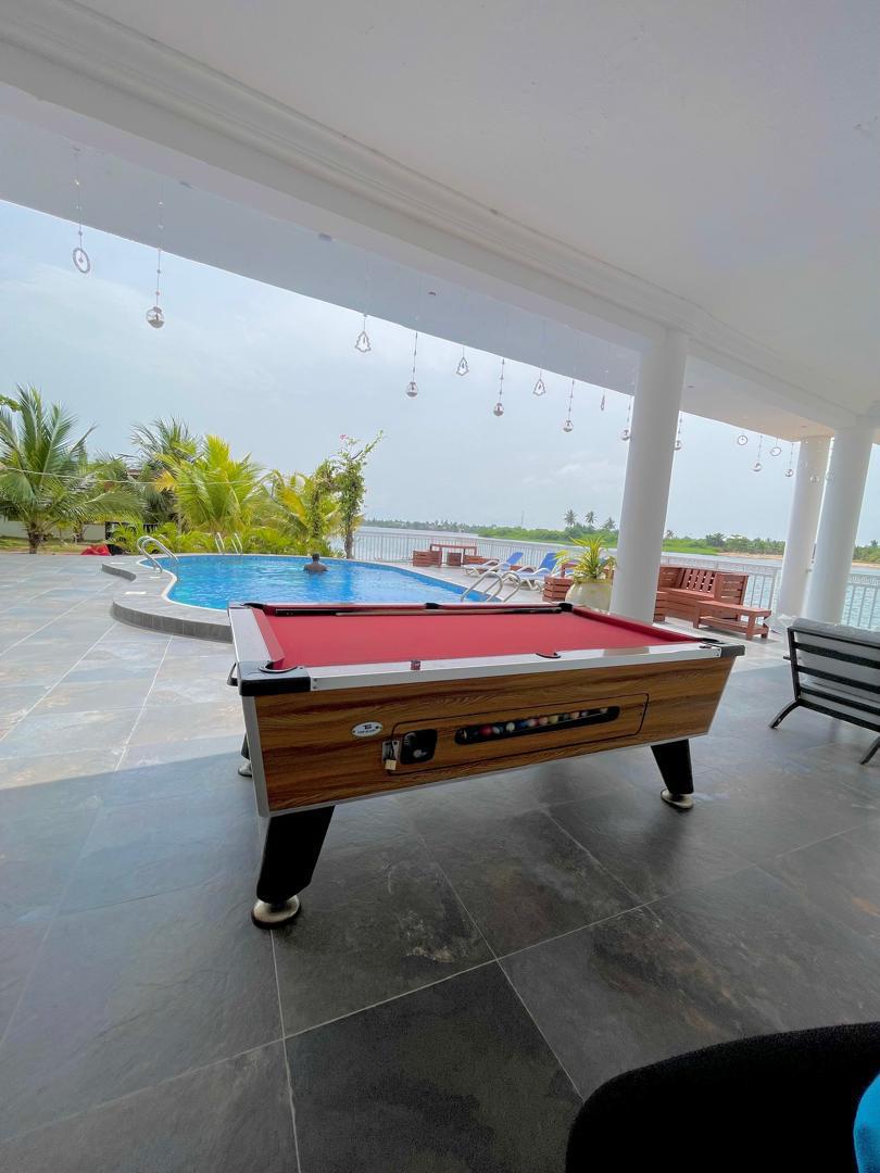 Poolside lounge with billiards table overlooking the estuary