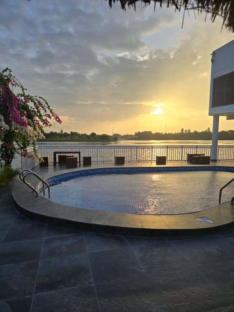 Poolside sunset over the Volta estuary at Ad Virgin Island Resort