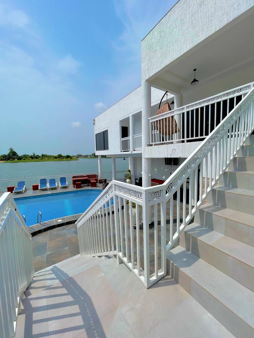 White villa and pool overlooking the estuary at Ad Virgin Island Resort
